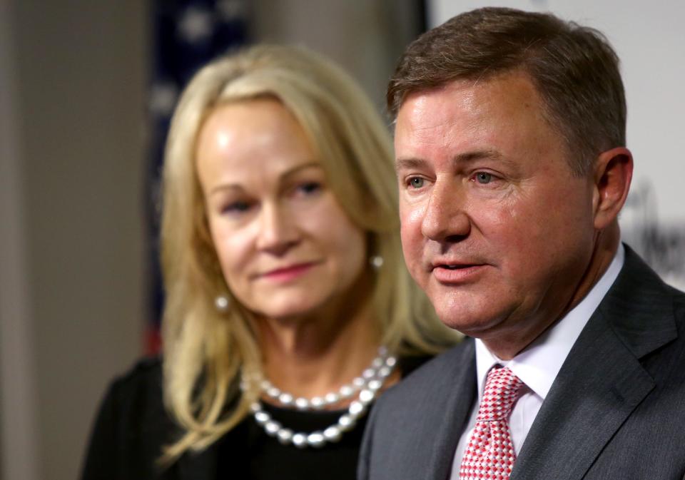 With his wife, Wendy Drummond, Gentner Drummond speaks to members of the media during a 2018 press conference in Tulsa.