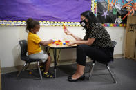 Teacher Juliana Urtubey, right, interacts with Kamari Wolfe in a class at Kermit R Booker Sr Elementary School Wednesday, May 5, 2021, in Las Vegas. Urtubey is the the 2021 National Teacher of the Year. (AP Photo/John Locher)