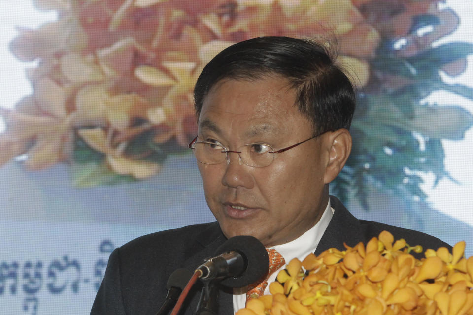 Cambodian business tycoon Ly Yong Phat delivers a speech during the Cambodia-China Business and Investment Forum on the outskirts of Phnom Penh, Cambodia, on Dec. 1, 2016. The European Union and United Nations abruptly rescheduled the launch of an anti-human trafficking program after being confronted with questions on the choice of venue: a Phnom Penh hotel owned by the Cambodian tycoon who has another property that has been used by human traffickers. (AP Photo/Heng Sinith)
