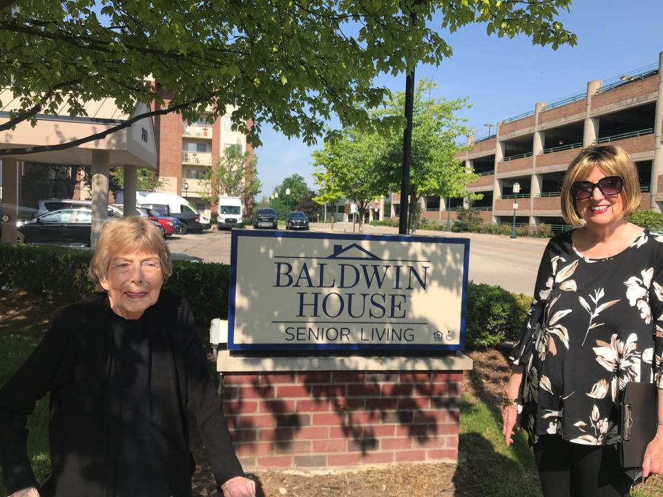 From left, Dorothy Conrad, who lives Birmingham's Baldwin House senior tower, stands with senior advocate Linda Buchanan next to the building's sign. Managers plan to change the sign by removing "Senior Living" and having it say "The Baldwin on Chester."