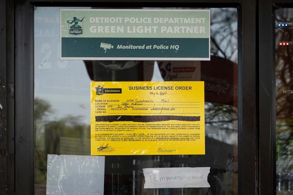 A business license order is taped to the doors of a Mobil gas station that remains shut down days after a triple-shooting on West McNichols Road near the John C. Lodge Freeway in Detroit on Wednesday, May 10, 2023. The gas station, which police said was unlicensed, has been shut down by the Detroit Buildings, Safety Engineering, and Environmental Department.