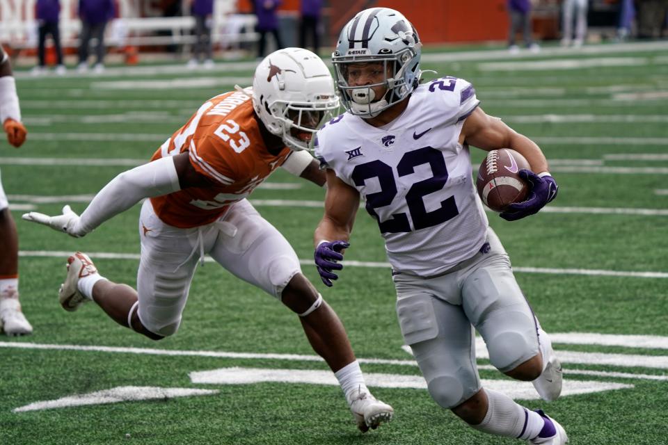 Kansas State running back Deuce Vaughn (22) runs past Texas defensive back Jahdae Barron (23) for a touchdown during the first half of last Friday's game in Austin, Texas.