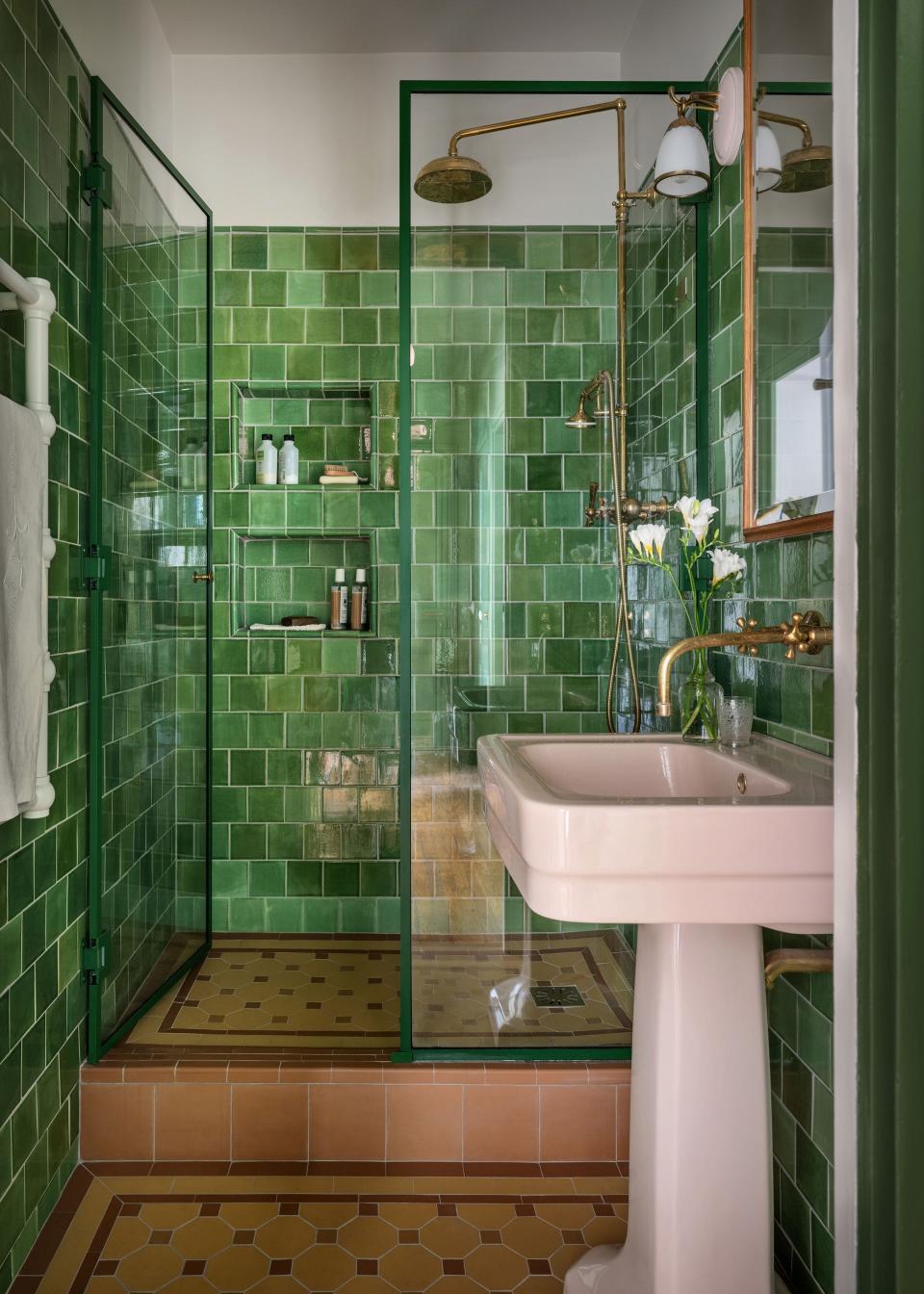 The bath has tile walls by Céramiques du Beaujolais and floor tiles by Winckelmans.