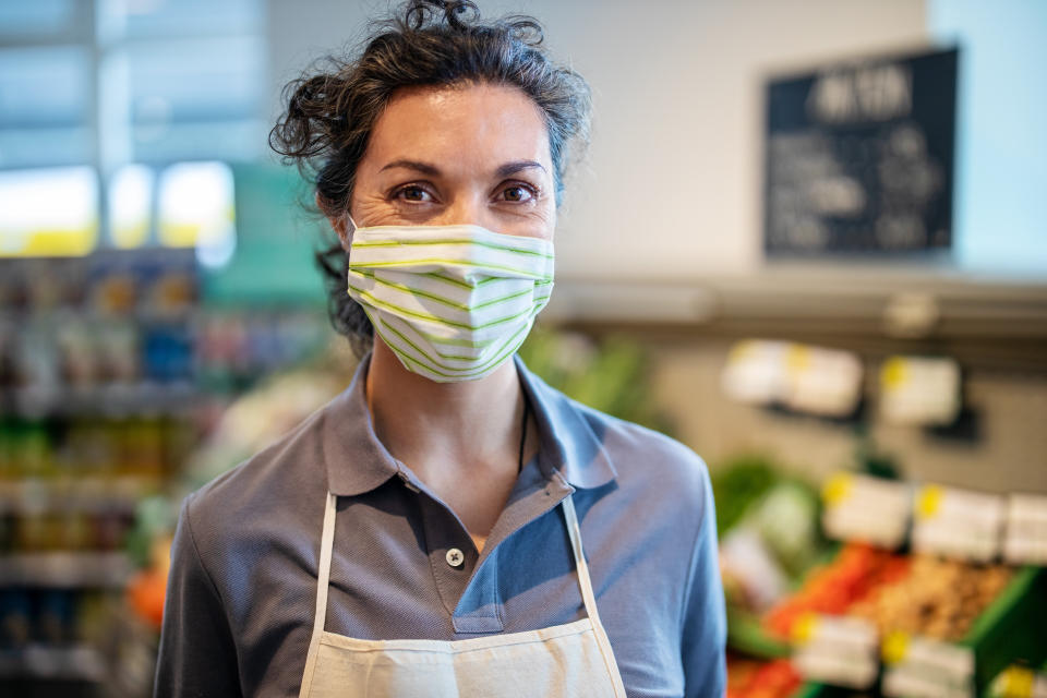 The CDC's new mask guidelines have workers wondering about the implications for their own jobs. (Photo: Luis Alvarez via Getty Images)