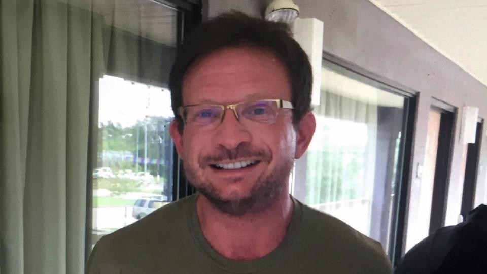 After a four-day manhunt, detectives found and arrested an oddly smiling Michael Handley at a Super 8 motel in Slidell, Louisiana. / Credit: 15th Judicial District Attorney's Office