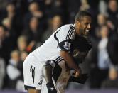 Swansea City's Wilfried Bony (R) celebrates scoring his second goal with Wayne Routledge, against Stoke City during their English Premier League soccer match at the Liberty Stadium in Swansea, Wales, November 10, 2013.