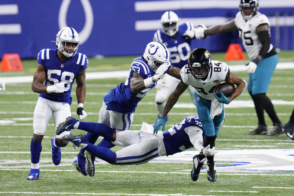 Jacksonville Jaguars' Keelan Cole Sr. is tackled by Indianapolis Colts' Julian Blackmon (32) during the first half of an NFL football game, Sunday, Jan. 3, 2021, in Indianapolis. (AP Photo/AJ Mast)