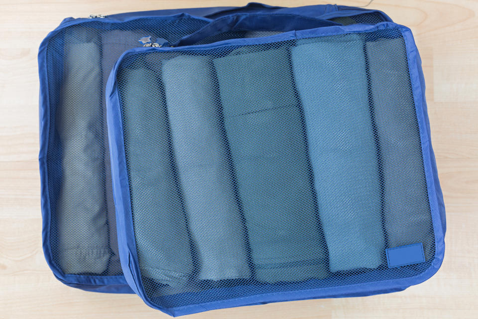 packing cube meshed bags with rolled clothes, t-shirt, pants. set of travel organizer to help packing luggage easy, well organized, amazon packing cubes