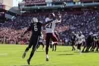 Oct 13, 2018; Columbia, SC, USA; Texas A&M Aggies defensive back Charles Oliver (21) makes an interception on a pass intended for South Carolina Gamecocks wide receiver Josh Vann (6) during the first quarter at Williams-Brice Stadium. Mandatory Credit: Jim Dedmon-USA TODAY Sports