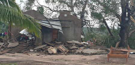 Damaged buildings are pictured from inside a vehicle after Cyclone Kenneth swept through the region in Cabo Delgado province, Mozambique April 26, 2019 in this image obtained from social media. UNICEF via REUTERS