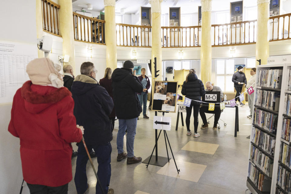 Citizens queue to vote at the Kallio Library in Helsinki during the parliamentary elections of Finland on Sunday, April 2, 2023. (Roni Rekomaa/Lehtikuva via AP)