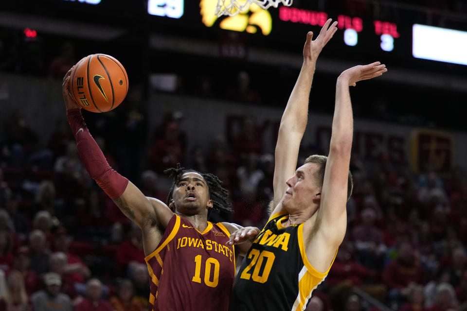 Iowa State guard Keshon Gilbert (10) drives to the basket past Iowa forward Payton Sandfort (20) during the second half of an NCAA college basketball game, Thursday, Dec. 7, 2023, in Ames, Iowa. (AP Photo/Charlie Neibergall)