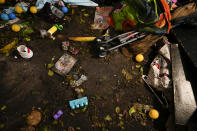 Toys and personal items lay scattered on the floor of a bedroom, in a ground-floor river-front apartment which was flooded during the passage of Hurricane Ian, at the Riverwalk housing complex in Fort Myers, Fla., Wednesday, Oct. 5, 2022. According to a neighbor who aided in the rescue and preferred not to be identified, the family with two young children who lived there was trapped inside after flooding from the river burst down their front door, tearing the jam from the wall, and flooded the apartment to waist-height. Neighbors helped them to safety in a nearby second-story unit.(AP Photo/Rebecca Blackwell)