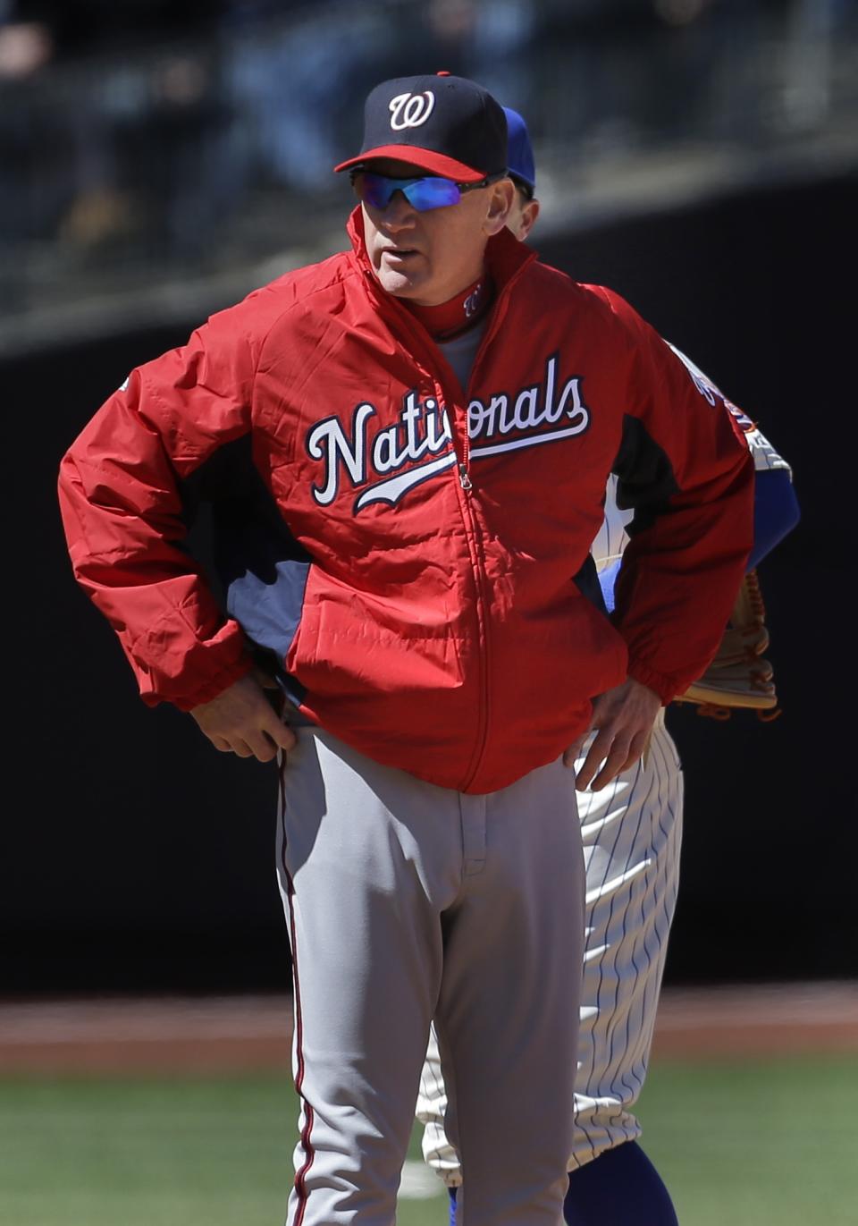 Washington Nationals manager Matt Williams stands on the field during the second inning of the baseball game against the New York Mets on Opening Day at Citi Field in New York, Monday, March 31, 2014. (AP Photo/Seth Wenig)