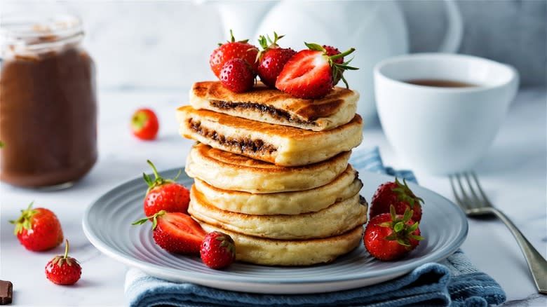 Chocolate-filled pancakes and strawberries 