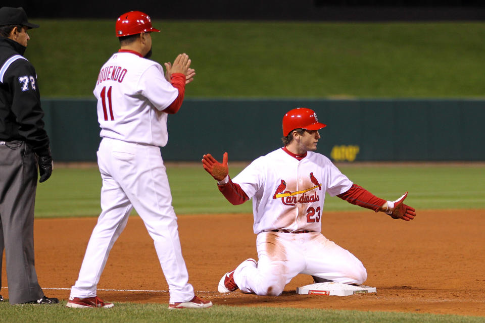 ST LOUIS, MO - OCTOBER 27: David Freese #23 of the St. Louis Cardinals celebrats at third base after hitting a game-tying two-run triple in the bottom of the ninth inning during Game Six of the MLB World Series against the Texas Rangers at Busch Stadium on October 27, 2011 in St Louis, Missouri. The Cardinals won 10-9 in 11 innings. (Photo by Ezra Shaw/Getty Images)