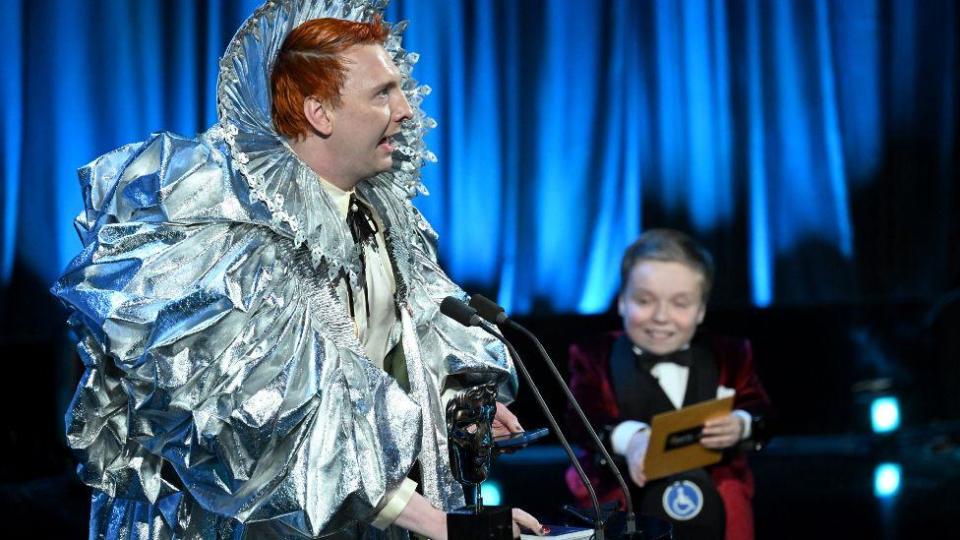 Joe Lycett accepts the Entertainment Performance Award for 'Late Night Lycett' from Lenny Rush onstage during the 2024 BAFTA Television Awards with P&O Cruises at The Royal Festival Hall on May 12, 2024 in London, England. (