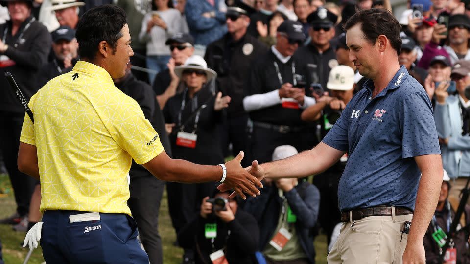 Poston congratulates Matsuyama on a spectacular round. - Harry How/Getty Images