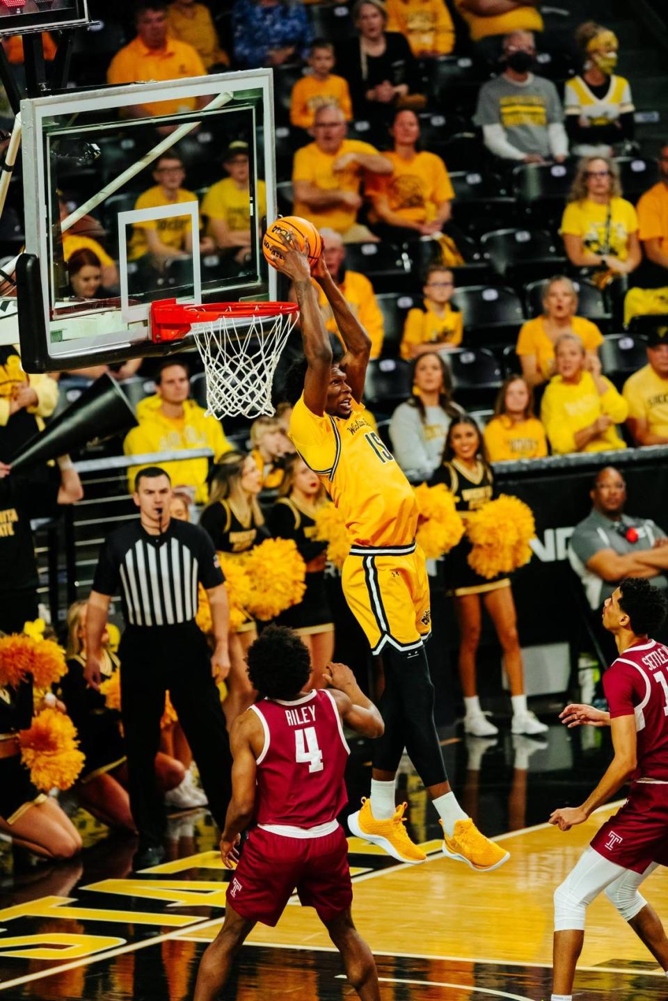 Wichita State center Quincy Ballard dunks an alley-oop in the first half against Temple at Koch Arena on Sunday afternoon.