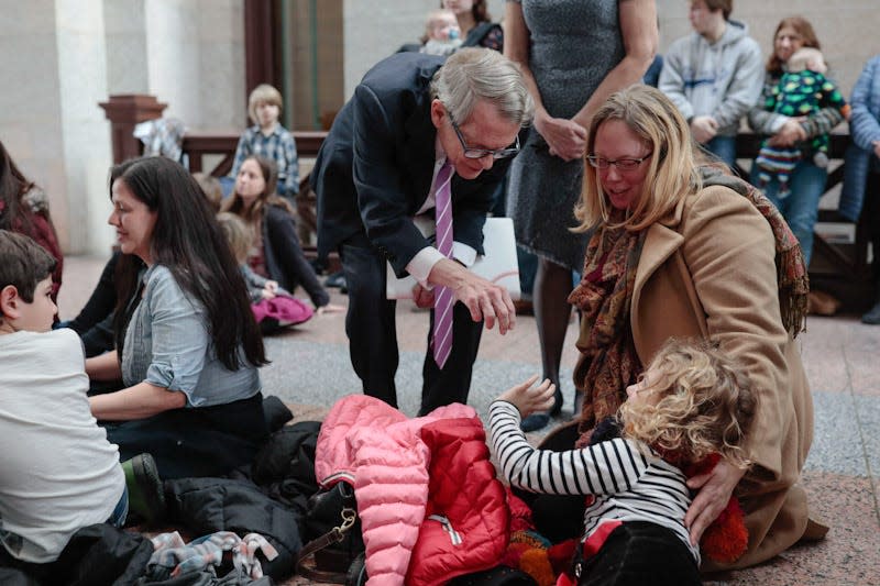 Ohio Gov. Mike DeWine greets a young attendee during the Greater Columbus Right to Life rememberance of Roe v. Wade, the 1973 U.S. Supreme Court decision that established a woman's legal right to an abortion, on Tuesday, January 22, 2019 at the Ohio Statehouse in Columbus, Ohio. [Joshua A. Bickel/Dispatch]