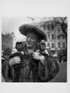 <p>Comedian Hylda Baker steps out in London with her two pet monkeys. Hylda was on her way to perform in the Prince of Wales Royal Variety Show in 1956 and arrived in town, with her pets in tow, beforehand. </p>