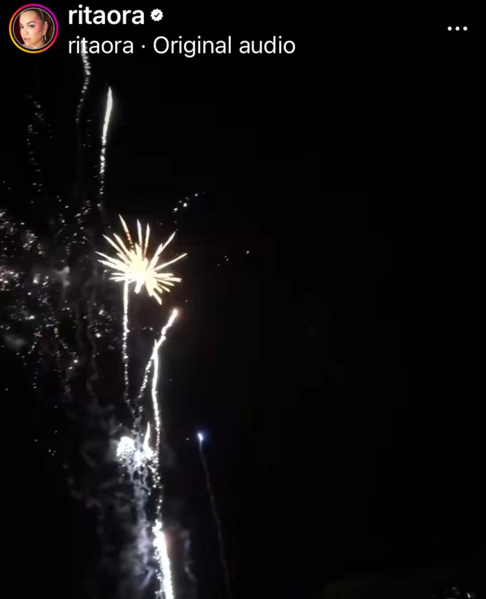 Ora and her husband took in the fireworks over the ocean during the clip (Instagram)