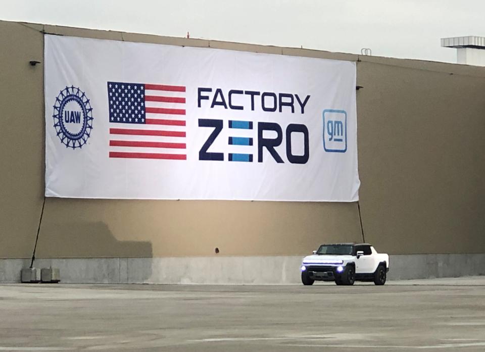 President Joe Biden sits inside General Motors 2022 GMC Hummer EV pickup at the grand opening of Factory ZERO on Nov. 17, 2021. Factory ZERO used to be called Detroit-Hamtramck Assembly. GM spent $2.2 billion to retool it to build all electric vehicles starting this month with the Hummer EV.