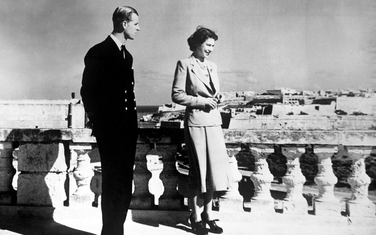 Princess Elizabeth and the Duke of Edinburgh on the roof terrace of the villa in Malta - PA