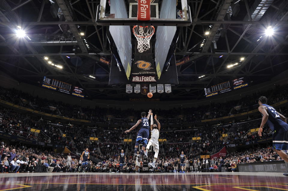 LeBron James shoots the game-winning jumper over Jimmy Butler in the final second of overtime, giving the Cavaliers a thrilling win over the Timberwolves. (David Liam Kyle/NBAE/Getty Images)