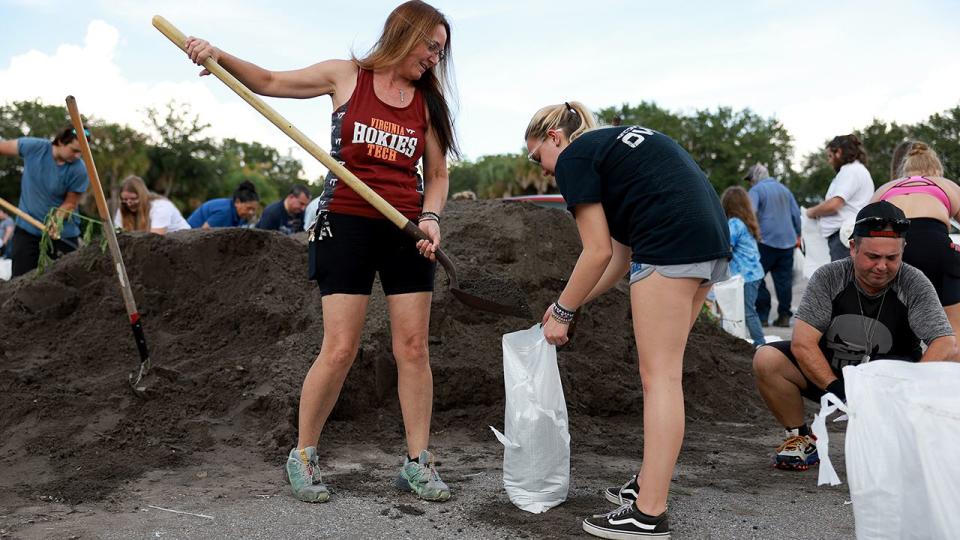 People fill sandbags at Helen Howarth Park as they prepare for the possible arrival of Hurricane Ian on September 26, 2022, in St. Petersburg, Florida.