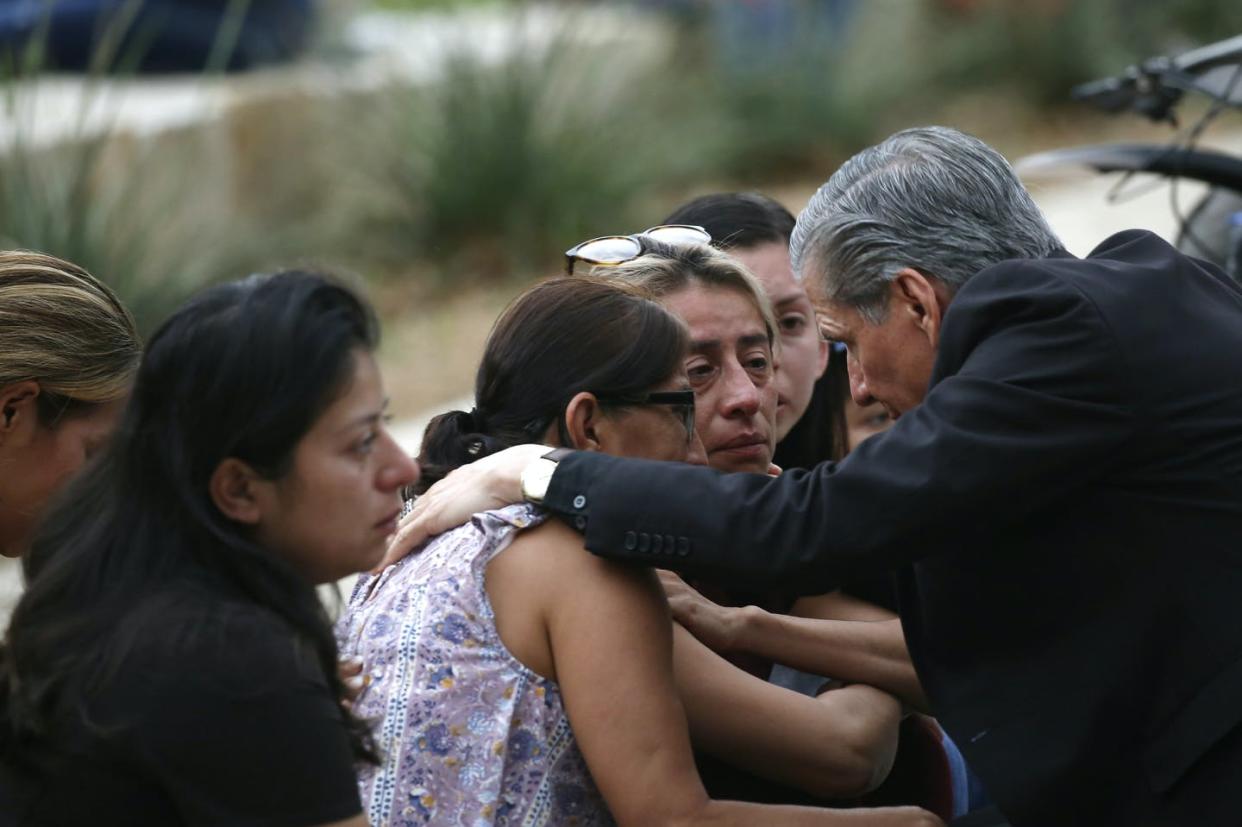 <span class="caption">The archbishop of San Antonio, Gustavo Garcia-Siller, comforts families following a deadly school shooting at a school in Uvalde, Texas, on May 24, 2022. </span> <span class="attribution"><a class="link " href="https://newsroom.ap.org/detail/CORRECTIONTexasSchoolShooting/5a865a4af618489aaefdaac9d0fee3b3/photo?Query=uvalde&mediaType=photo&sortBy=arrivaldatetime:desc&dateRange=Anytime&totalCount=92&currentItemNo=3" rel="nofollow noopener" target="_blank" data-ylk="slk:AP Photo/Dario Lopez-Mills;elm:context_link;itc:0;sec:content-canvas">AP Photo/Dario Lopez-Mills</a></span>