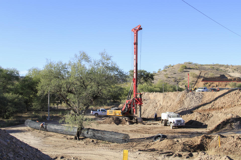 Construction continues for a new train line in northern Mexico, in San Lorenzo, Sonora state, Mexico, Monday, Nov. 13, 2023. Residents in the northern state of Sonora are battling the new train line which they say threatens to displace their homes and cut up the local ecosystem. (AP Photo/Luis Castillo)