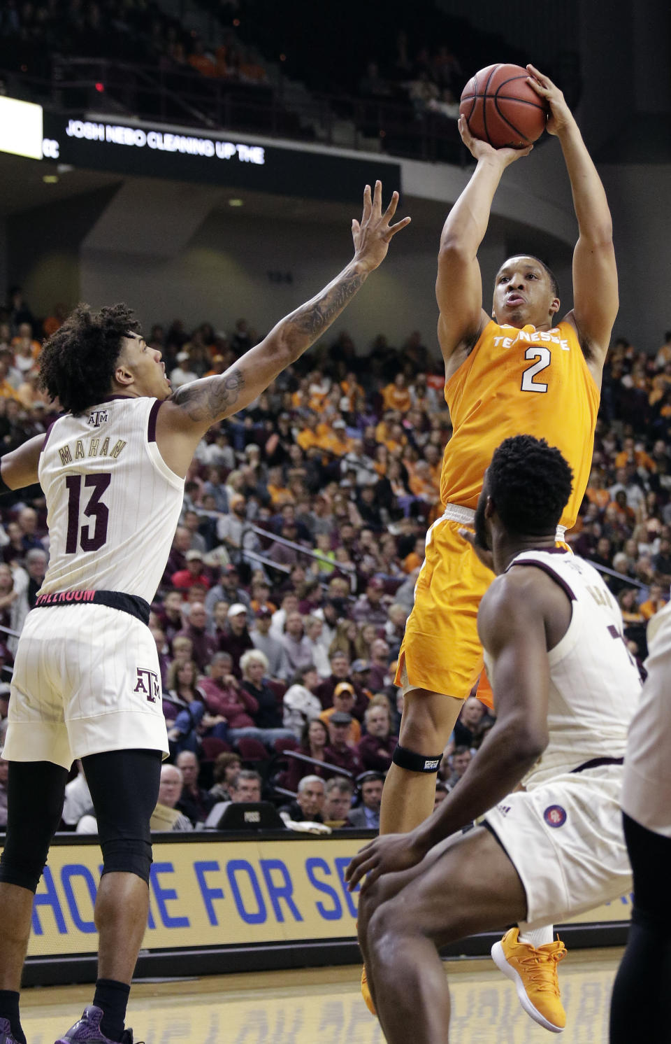 Tennessee forward Grant Williams (2) shoots over Texas A&M guard Brandon Mahan (13) and forward Josh Nebo, right, during the first half of an NCAA college basketball game Saturday, Feb. 2, 2019, in College Station, Texas. (AP Photo/Michael Wyke)