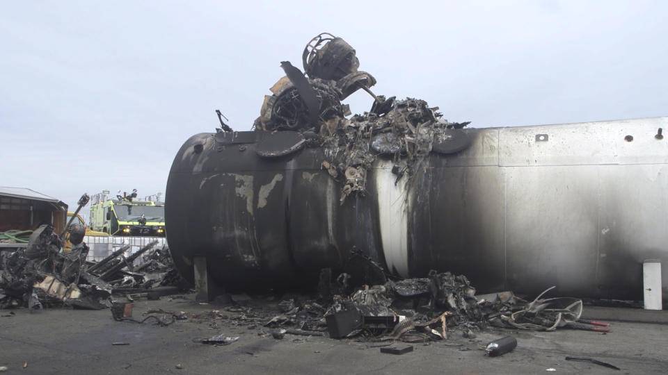 This image taken from video provided by National Transportation Safety Board shows damage from a World War II-era B-17 bomber plane that crashed Wednesday at Bradley International Airport, Thursday, Oct. 3, 2019 in Windsor Locks, Conn. The plane crashed and burned after experiencing mechanical trouble on takeoff Wednesday morning from Bradley International Airport. (NTSB via AP)