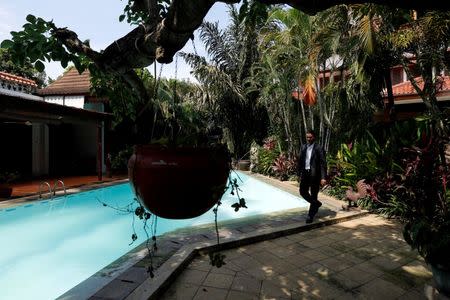 Property broker Julizar walks at an empty rental house at Kemang district in Jakarta, Indonesia, June 23, 2016. Picture taken June 23, 2016. REUTERS/Bewiharta