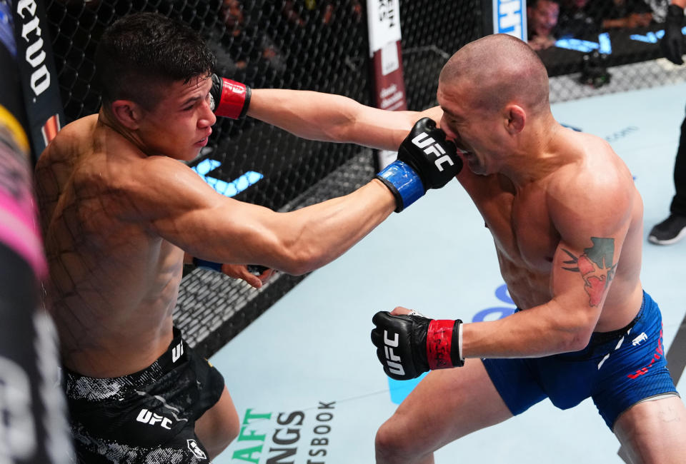 LAS VEGAS, NEVADA – APRIL 06: (L-R) Jean Matsumoto of Brazil punches Dan Argueta in a bantamweight fight during the UFC Fight Night event at UFC APEX on April 06, 2024 in Las Vegas, Nevada. (Photo by Jeff Bottari/Zuffa LLC via Getty Images)
