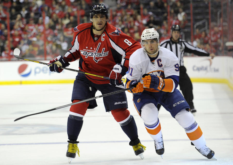 FILE - In this Nov. 5, 2013, file photo, Washington Capitals right wing Alex Ovechkin (8), of Russia, skates next to New York Islanders center John Tavares (91) during the first period of an NHL hockey game in Washington. Sidney Crosby and the Pittsburgh Penguins are hitting Broadway to face the Blueshirts for the NHL playoffs for the second straight year. Lightning GM Steve Yzerman&#39;s facing his former team in Detroit. Ottawa and Montreal face off in a cross-border rivalry. And then there&#39;s Ovechkin vs. Tavares in a full slate of compelling Eastern Conference first-round matchups. (AP Photo/Nick Wass, File)