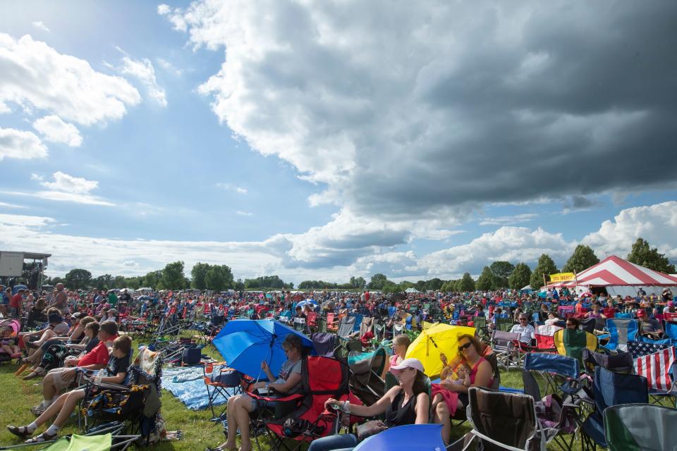 People sit in lawn chairs watching the afternoon main stage events on the Lifest event grounds in 2016. The event will take place July 6 to 9 this year.