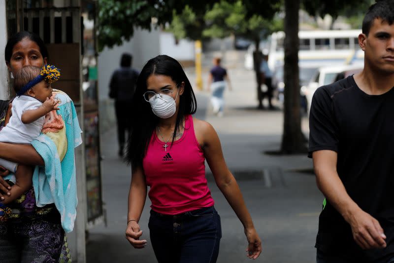 A woman wears a protective mask in response to coronavirus (COVID-19) spread, in Caracas