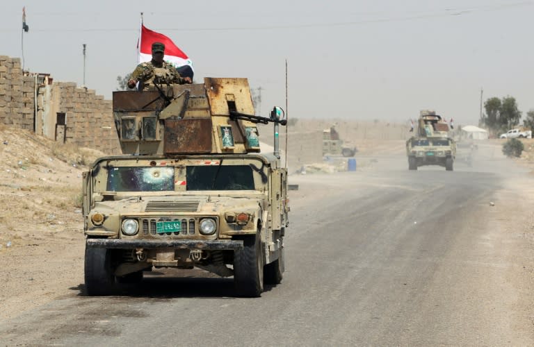 Iraqi pro-government forces reach al-Sejar village on the boundary of Fallujah, on May 28, 2016, as they take part in a major assault to retake the city from the Islamic State group