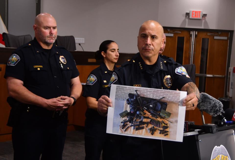 Palm Bay Police Chief Mariano Augello, at a Monday afternoon press conference, held up a photo of the weapons that Brandon Kapas had in his car.