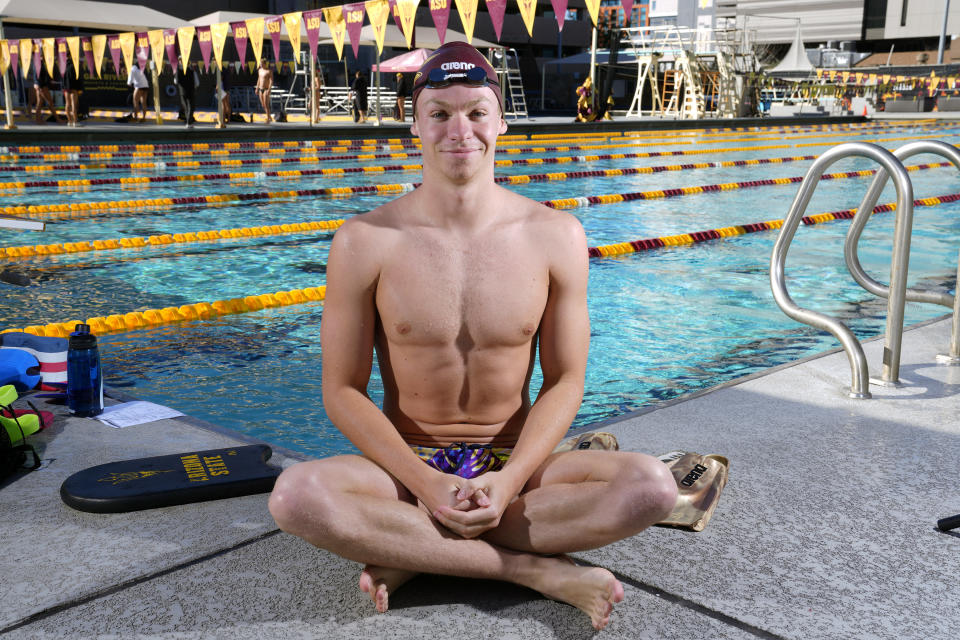 French Olympic swimmer Leon Marchand poses for a photograph prior to work out at Arizona State University, Tuesday, Feb. 13, 2024, in Tempe, Ariz. With family and friends — an entire nation — watching, the individual medley specialist is poised to be one of the premier faces of these Olympics. (AP Photo/Ross D. Franklin)