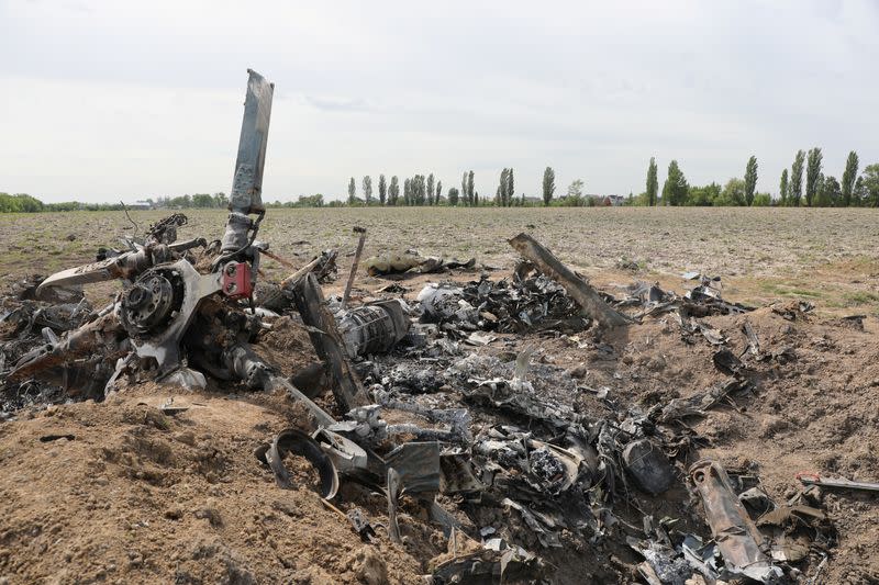 Destroyed Russian military helicopter is seen near the town of Makariv