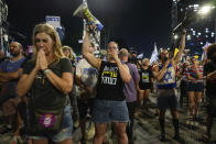 People protest against Israeli Prime Minister Benjamin Netanyahu's government and call for the release of hostages held in the Gaza Strip by the Hamas militant group, in Tel Aviv, Israel, Saturday, June 29, 2024. (AP Photo/Ohad Zwigenberg)