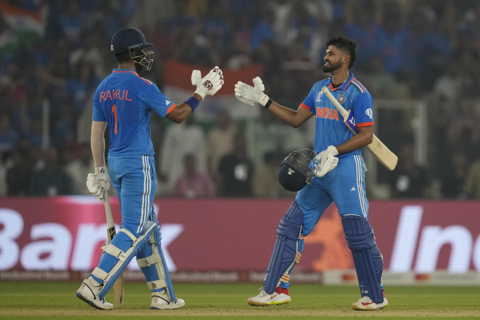 India's Shreyas Iyer, right, and India's KL Rahul celebrate their win in the ICC Men's Cricket World Cup match between India and Pakistan in Ahmedabad, India, Saturday, Oct. 14, 2023.(AP Photo/Rajanish Kakade)