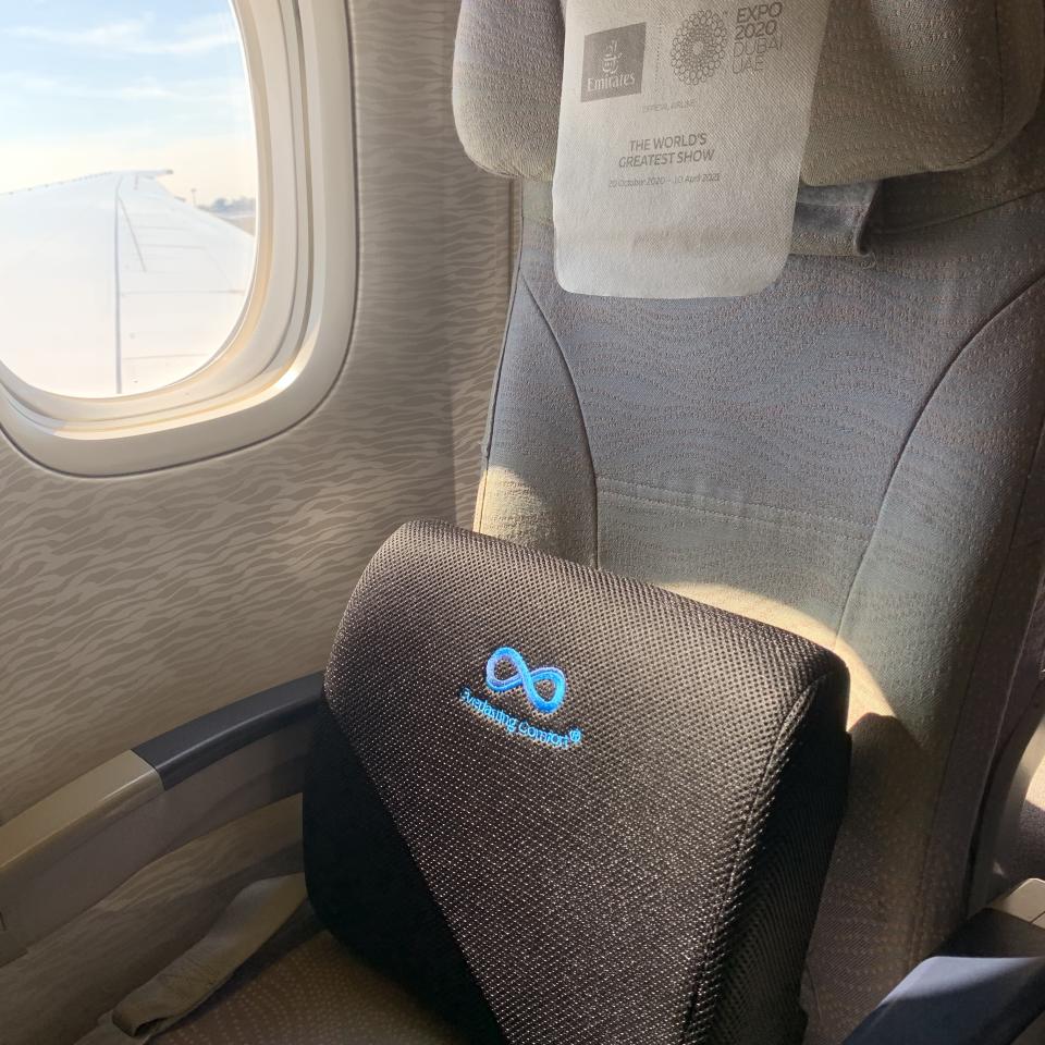 using my Everlasting Comfort lumbar support cushion on my Emirates flight from Lisbon to Dubai (Katie Jackson / TODAY)