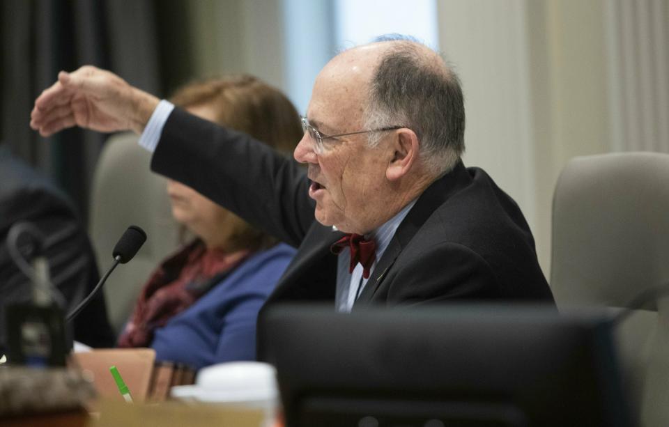 Bob Cordle, state board of elections chairman, asks questions about new documents entered into evidence during the fourth day of a public evidentiary hearing on the 9th Congressional District voting irregularities investigation Thursday, Feb. 21, 2019, at the North Carolina State Bar in Raleigh. (Travis Long/The News & Observer via AP)