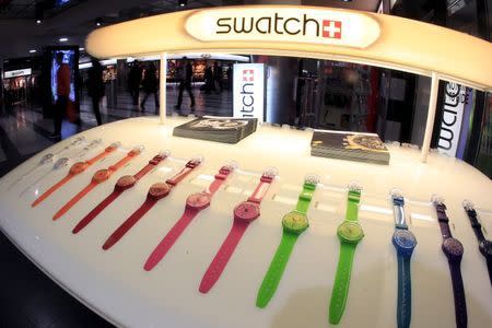 Swatch watches are displayed in front of a shop at the central station in Zurich in this February 4, 2013 file photo. REUTERS/Arnd Wiegmann/Files