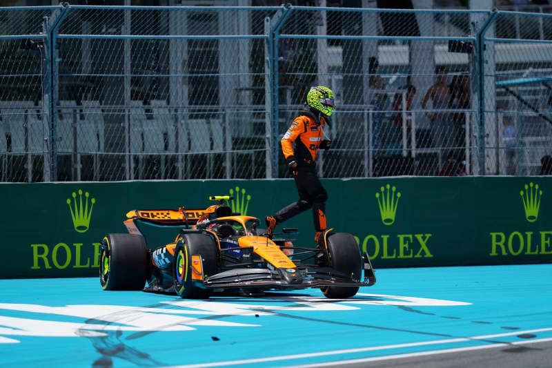 British racing driver Lando Norris of the McLaren F1 Team jumps off of his car after crashing on the opening lap of the Sprint Race at the Formula 1 Crypto.com Miami Grand Prix in Miami Richard Dole/ZUMA Press Wire/dpa