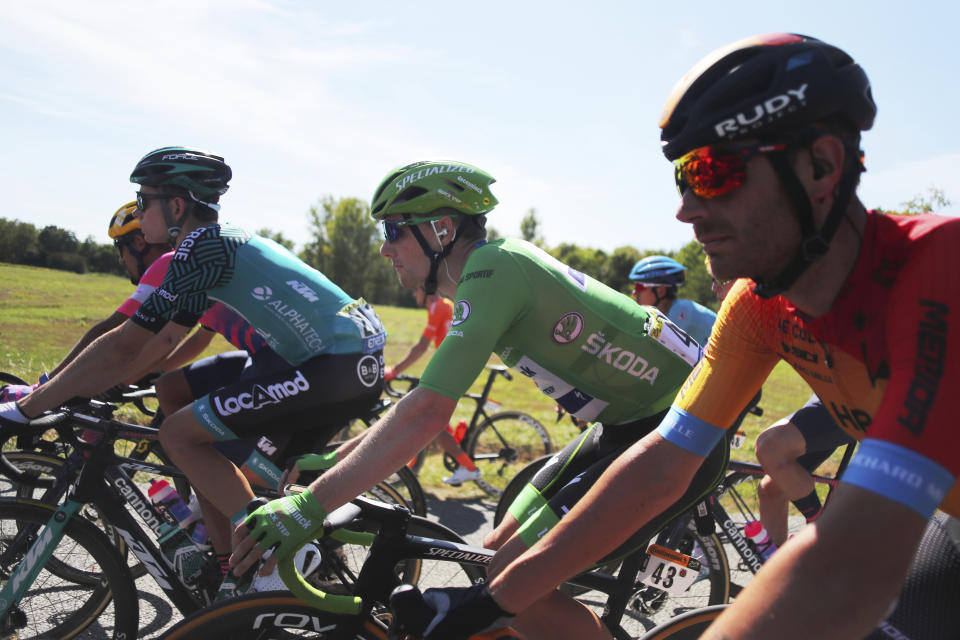 Ireland's Sam Bennett, wearing the best sprinters green jersey rides in the pack during the 14th stage of the Tour de France cycling race over 194 kilometers (120,5 miles) with start in Clermont-Ferrand and finish in Lyon, France, Saturday, Sept. 12, 2020. (AP Photo/Thibault Camus)